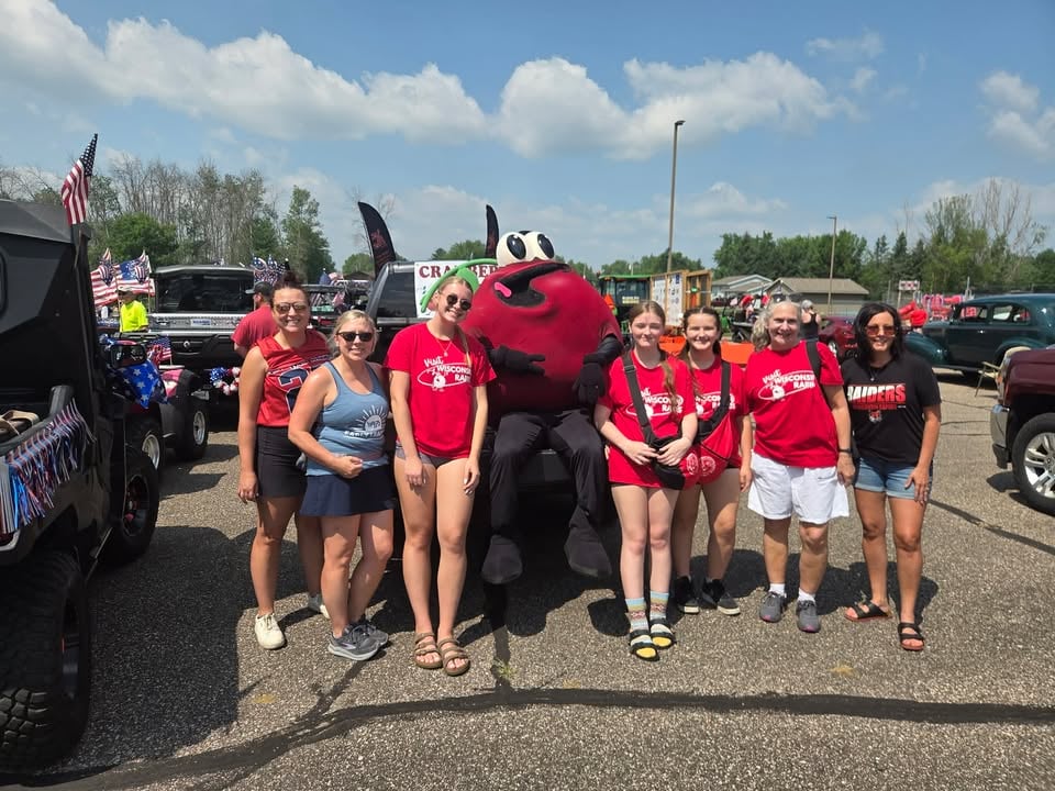 Students posing with mascot