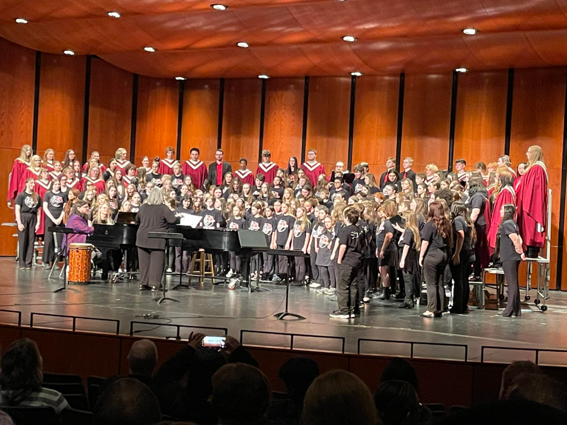 WI Rapids Show Choir practicing on stage