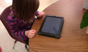Student with a tablet.